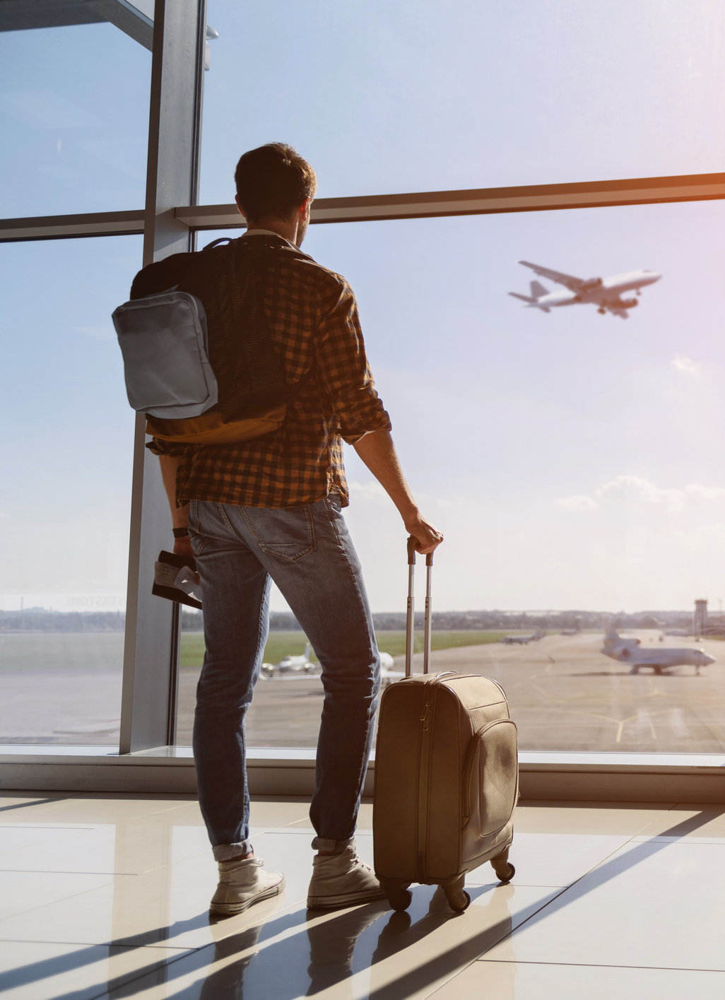 Traveler at an airport preparing for an international trip